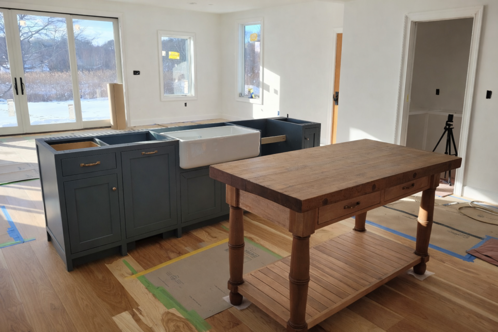 Before renovation kitchen in Gloucester, MA prior to structural wall removal — enclosed layout and limited natural light