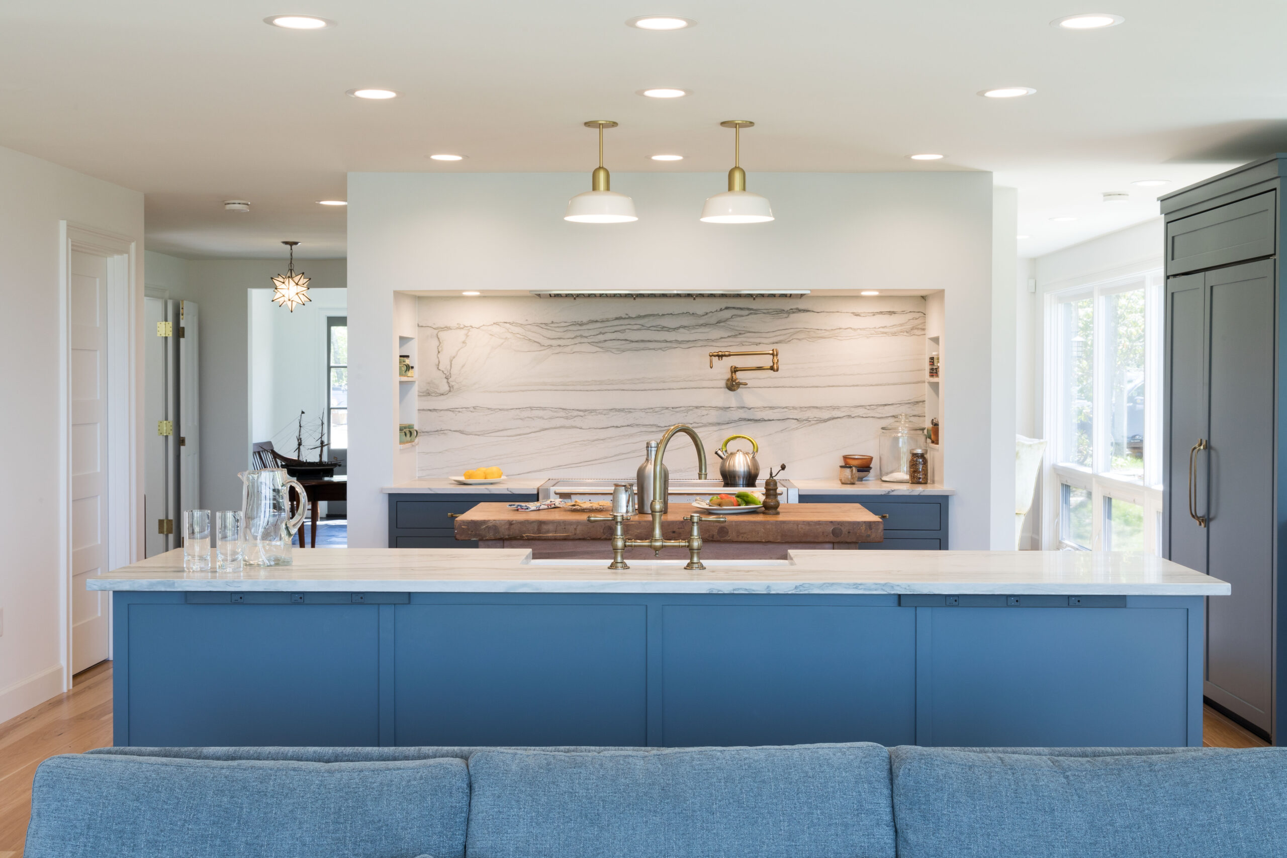 Cape Ann kitchen conversion in Gloucester, MA by WORKS By JD featuring open-concept layout, white oak cabinetry, and quartz countertops