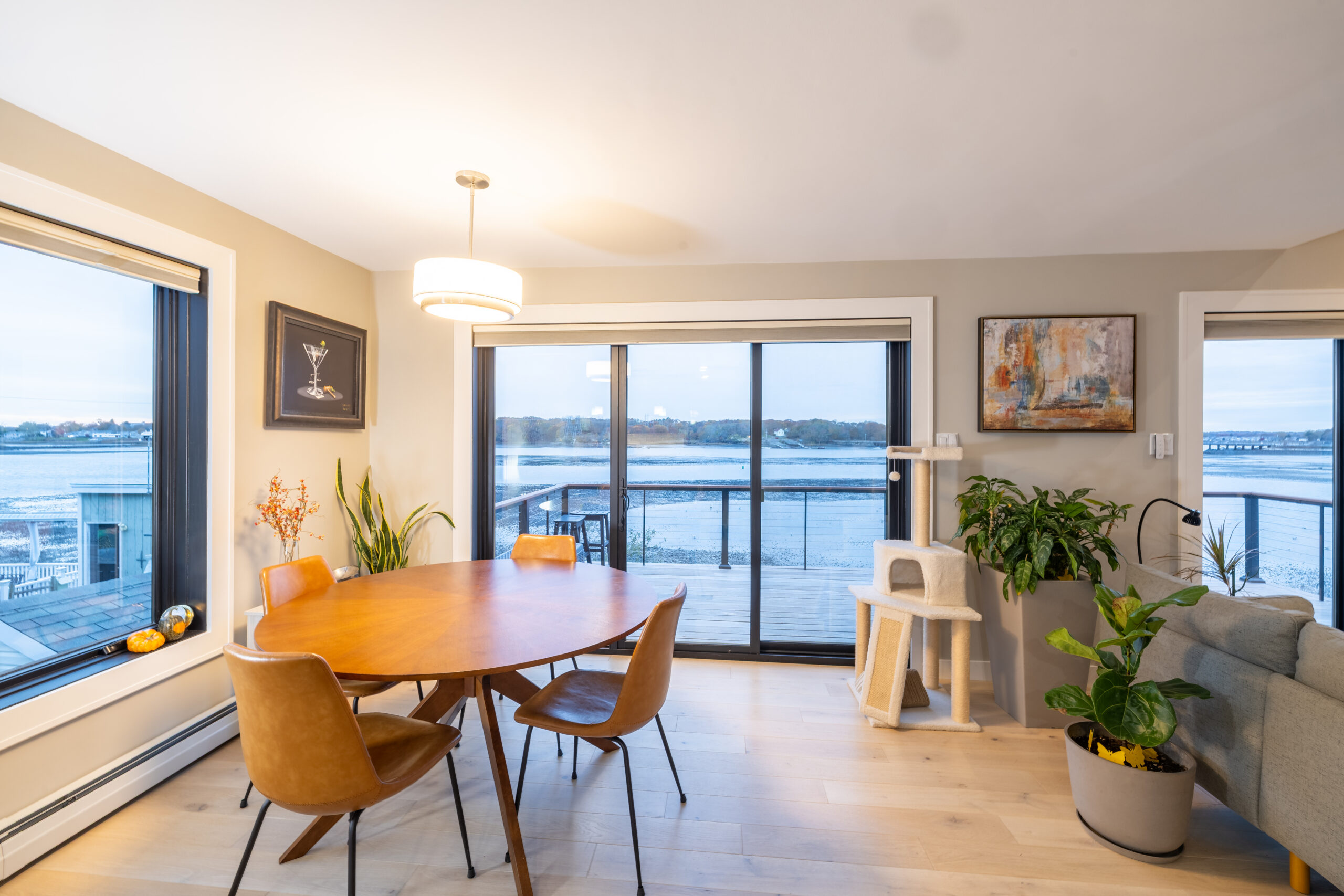 North Shore Boston waterfront dining room with modern design, hardwood floors, and balcony view