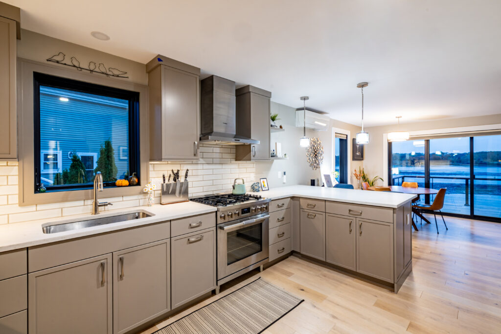 North Shore Boston waterfront dining room with modern design, hardwood floors, and balcony view