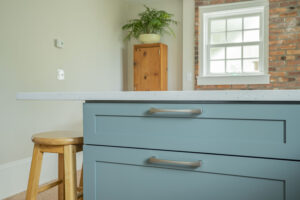 North Shore MA kitchen remodel with blue cabinets, quartz countertop, and custom cabinetry details