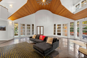 North Shore MA living room remodel with vaulted wood ceiling, open layout, and custom architectural design