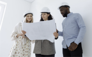Home remodeling team reviewing construction blueprints for a residential renovation project